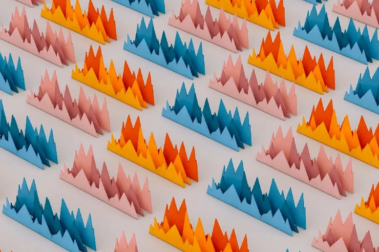 Vibrantly colored paper mounds resembling a playful and imaginative mountain scene