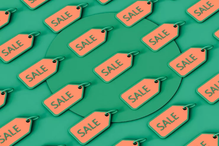 Stock photo featuring sale tags on a vibrant green background